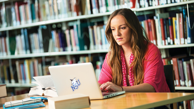 Student studying at library